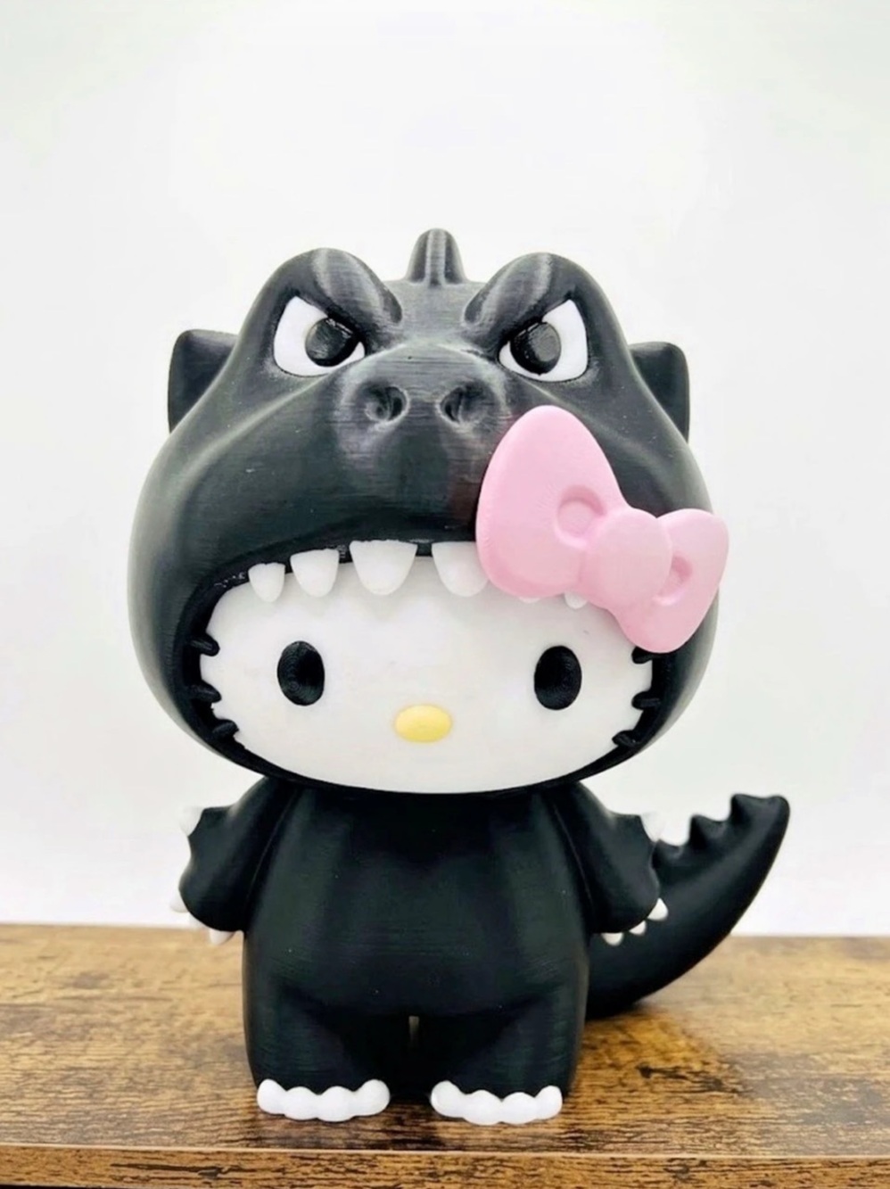 3D-printed Hello Kitty x Godzilla figure